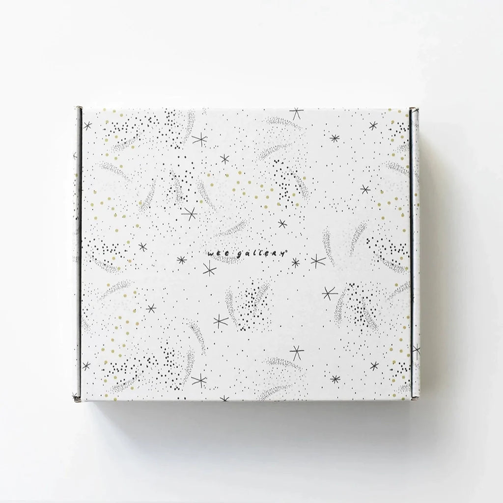 Wee Gallery Ocean Little Naturalist Gift Set Baby Activity Set. View of the exterior product packaging. Off white box with stars and dots. Brand logo in black in the center of the box.