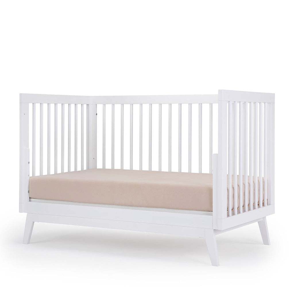 dadada White Soho 3-in-1 Convertible Crib to Toddler Bed Furniture. Shown converted into a Day Bed.