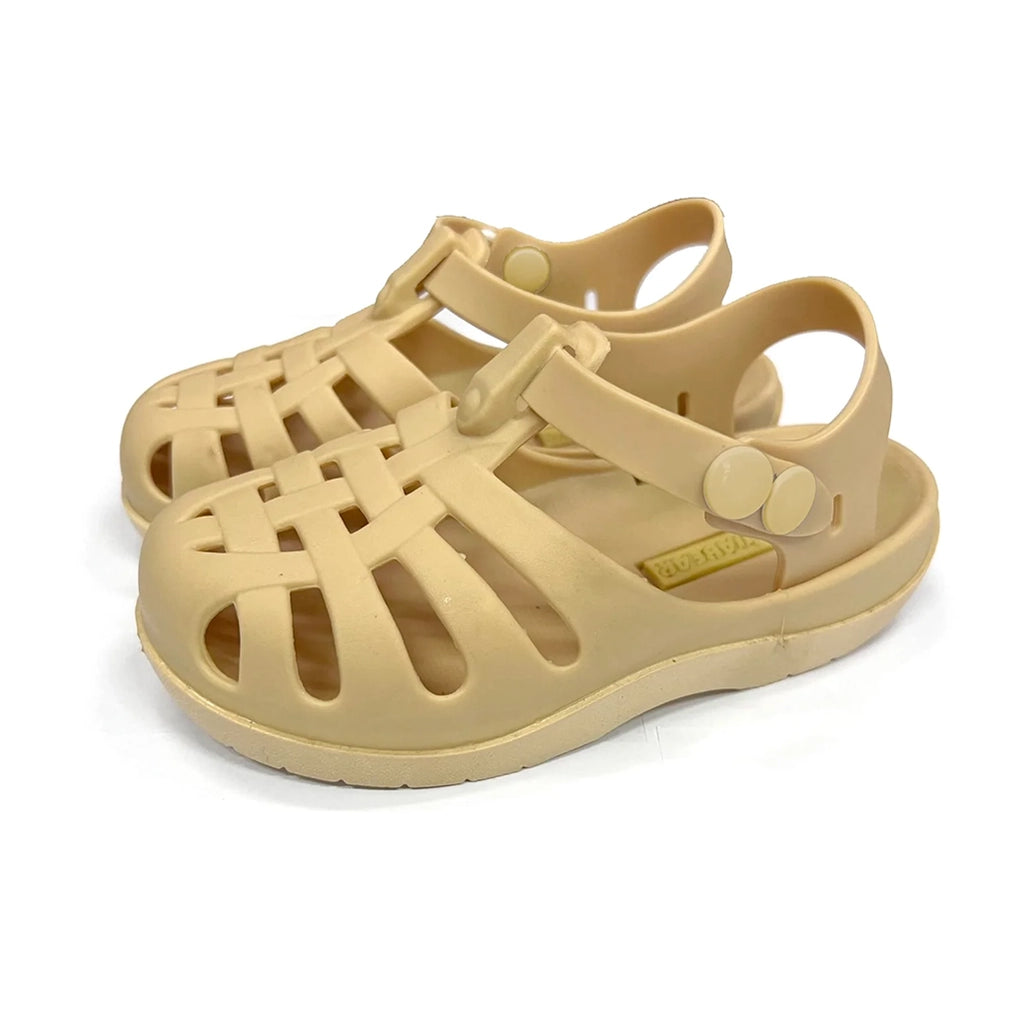 Mrs Ertha Honey Boo Floopers Children's Silicone Summer Sandals. Light yellow silicone sandals with two button straps and a lattice pattern for air flow.