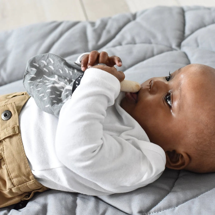 Baby with Wee Gallery Crinkle Acorn Teething Ring