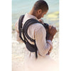 view of dad holding baby in babybjorn carrier free anthracite straps