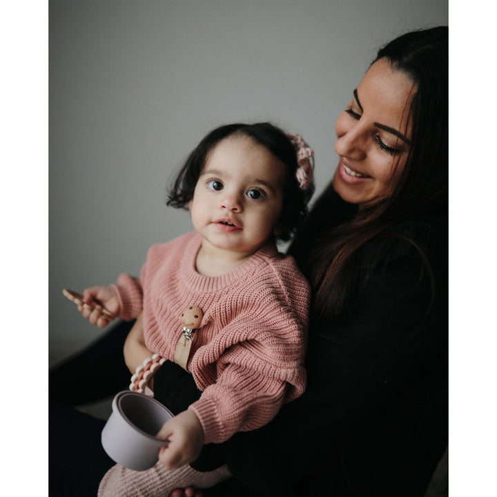 Mushie soft silicone teething toys designed for tiny hands and sore gums