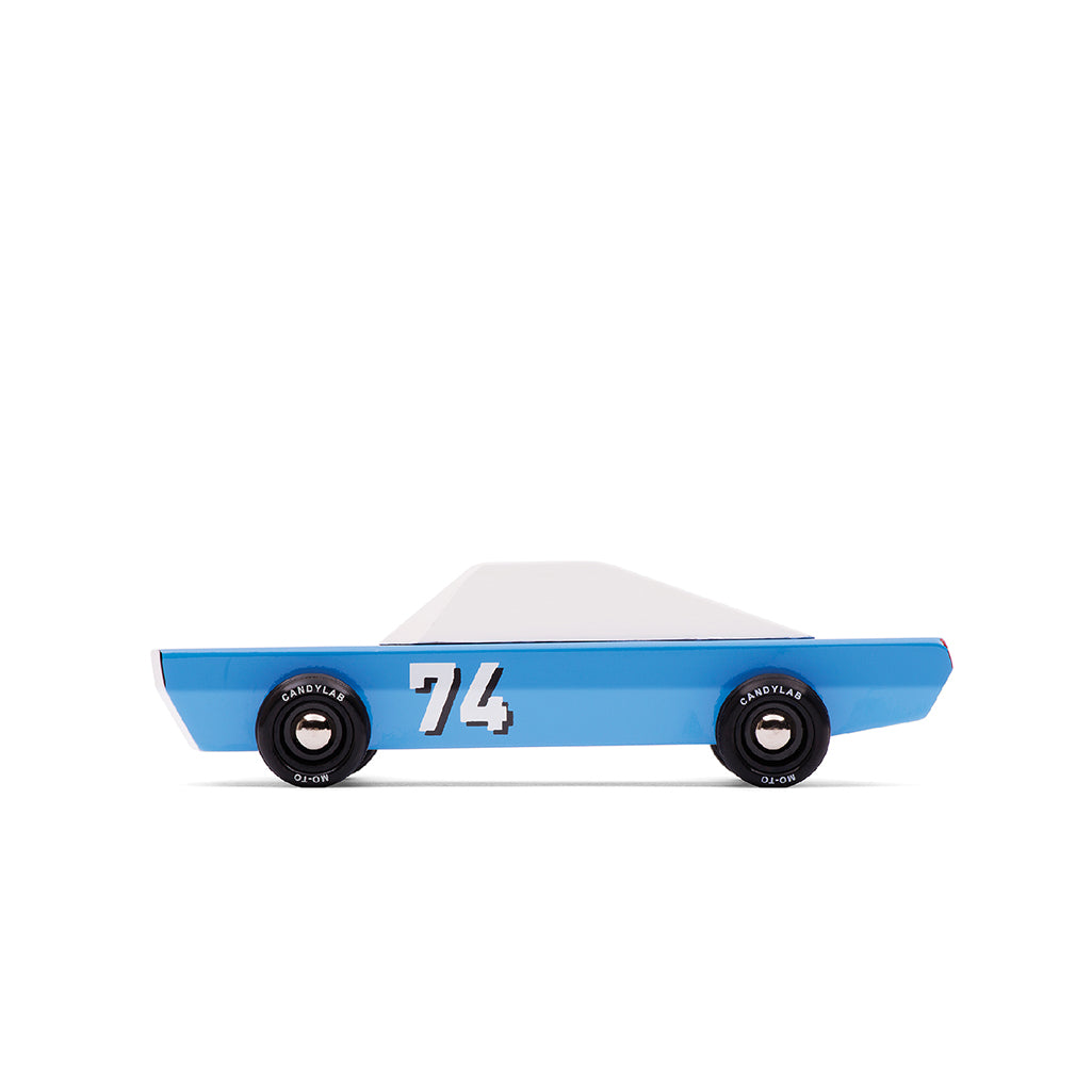 A Candylab Toys Racecar Blu 74, a wooden children's toy car in blue and white for racing pretend play.