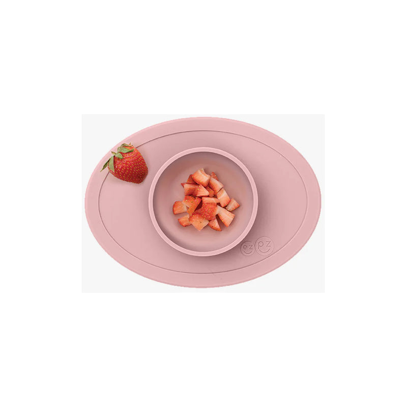 The Blush ezpz baby solid food bowl stays in place with strong suction.