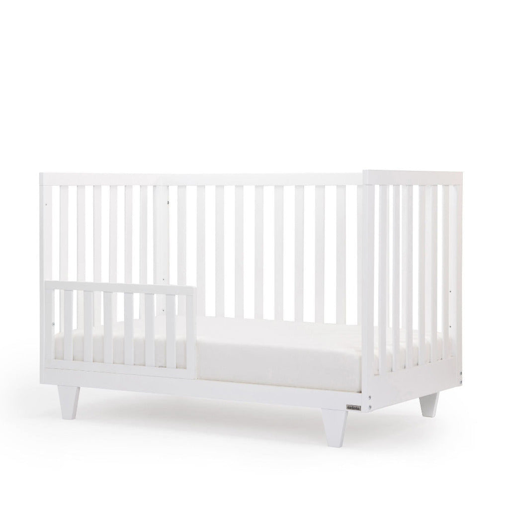 dadada White Cambridge Crib Infant Baby Nursery Furniture. toddler bed side angle. Baby cribs for sale