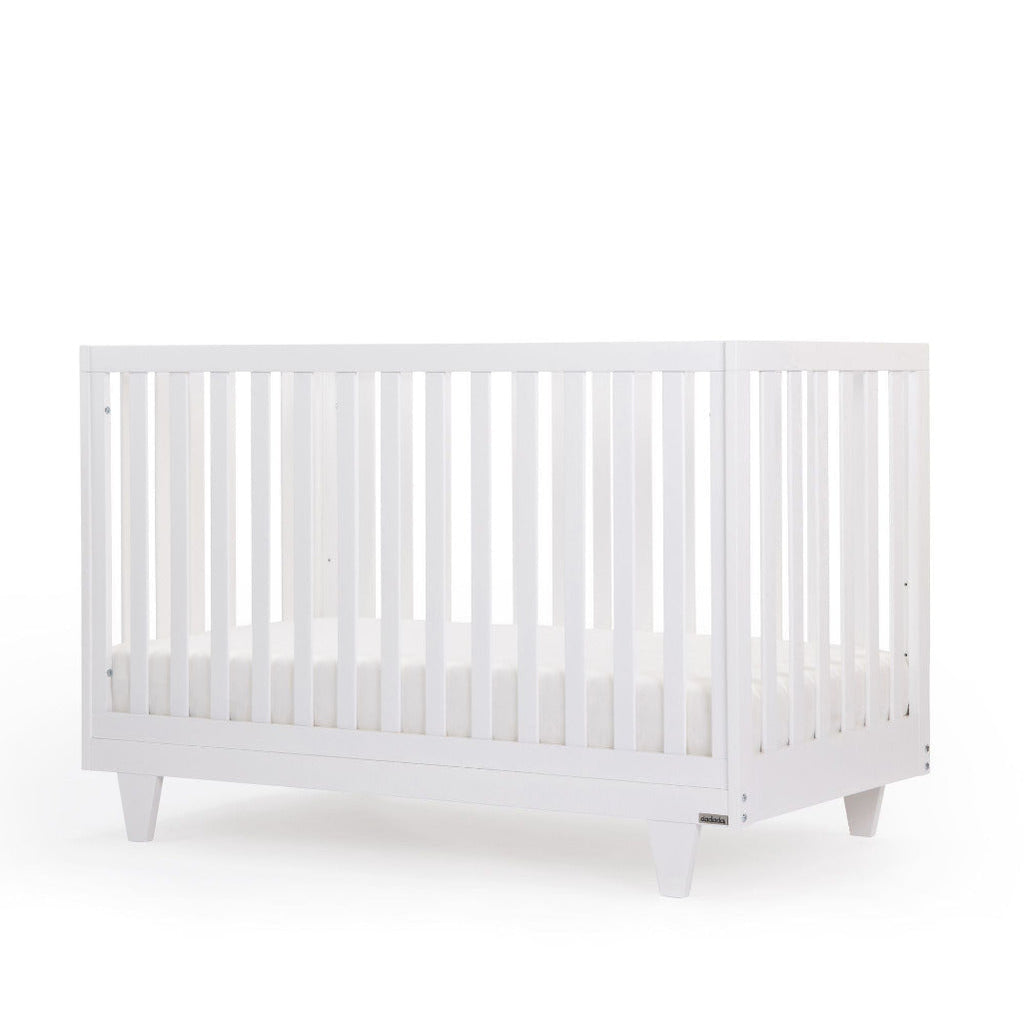 dadada White Cambridge Crib Infant Baby Nursery Furniture. angle view. Baby girl nursery ideas. Baby nursery furniture