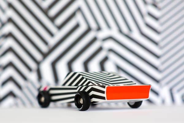Candylab ghost car for kids and collectors , a stylish black-and-white striped toy vehicle.