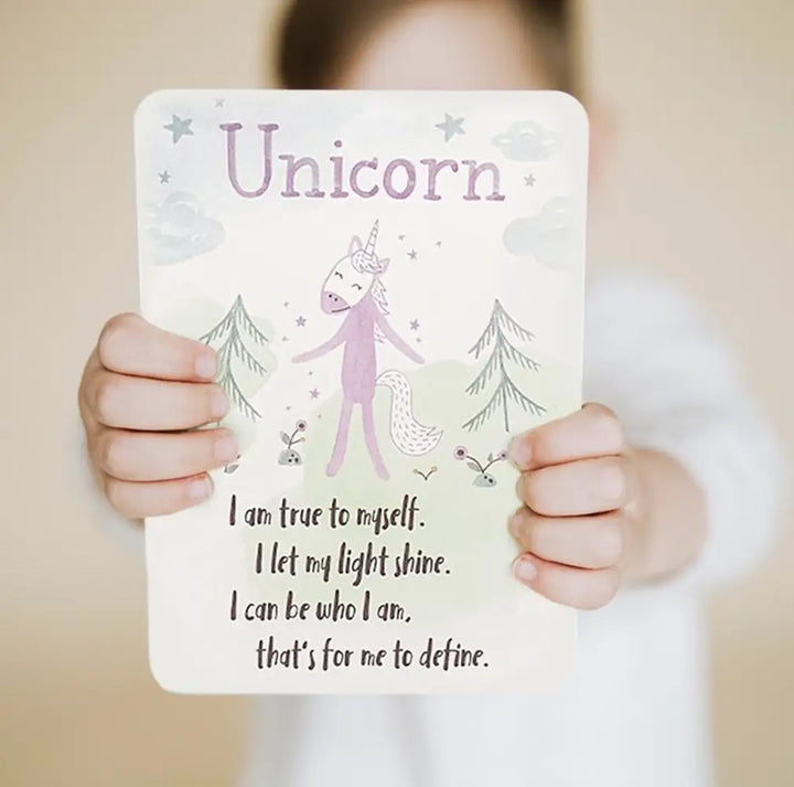 child holding Slumberkins Rose Unicorn book for Authenticity