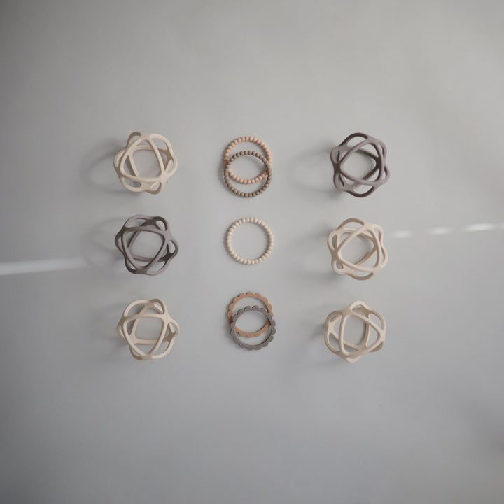 Mushie teething toys with vibrant colors and textures to soothe and engage your baby