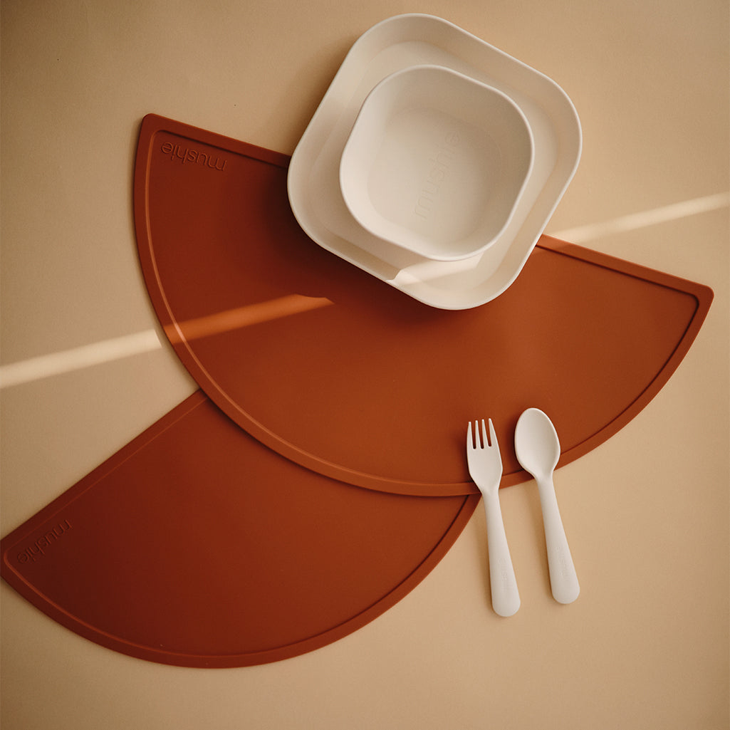 Mushie Silicone Placemat in Clay A beautiful warm tone that works well in any dining setting