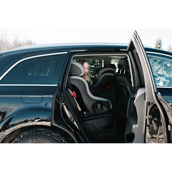 Child sitting in the Clek Foonf Best Convertible Car Seat