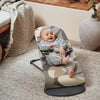 infant laughing in Baby Bjorn khaki green baby bouncer seat