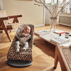 baby laughing in Baby Bjorn leopard print quilt cotton bouncer bliss