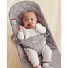 infant resting in BabyBjorn cotton sand grey quilt bliss bouncer