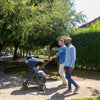 Men walk with toddler in Uppababy CRUZ V2 Stroller