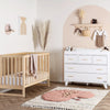 dadada White Boston 5-Drawer Dresser Children's Nursery Furniture. Shown in a nursery.