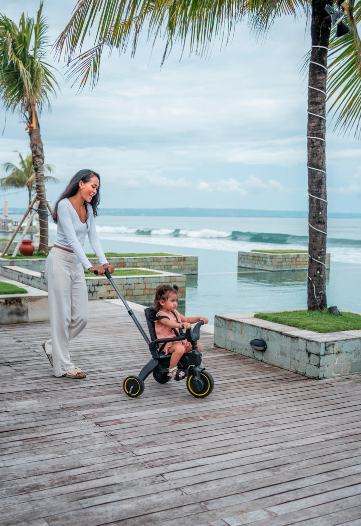 Doona Liki Trike S5 Nitro Black, foldable and safe, ideal toddler stroller for indoor and outdoor activities.