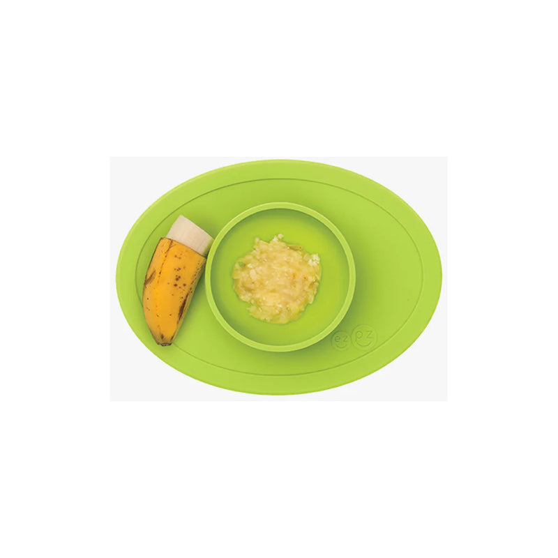 The Lime Green ezpz baby solid food bowl helps reduce spills with a secure suction base.