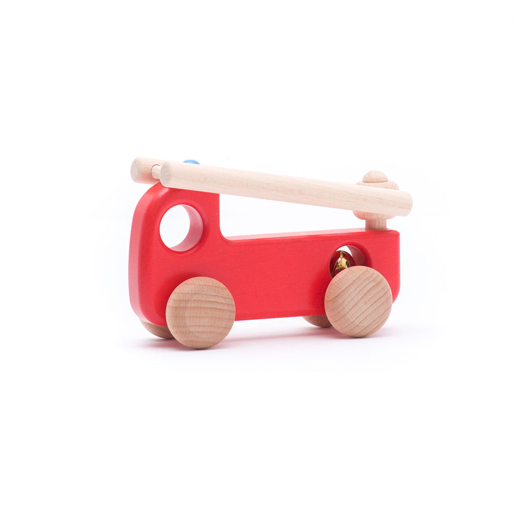 A vibrant red wooden fire engine by BAJO, crafted for toddlers.