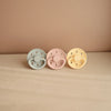 FRIGG Moon Phase Natural Rubber Baby Pacifier. Three color variations pictured together.