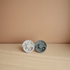 FRIGG Moon Phase Natural Rubber Baby Pacifier. Two color variations pictured together.