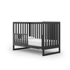 dadada Black Austin 3-in-1 Convertible Crib shown with toddler rail. Sold separately. Toddler bed