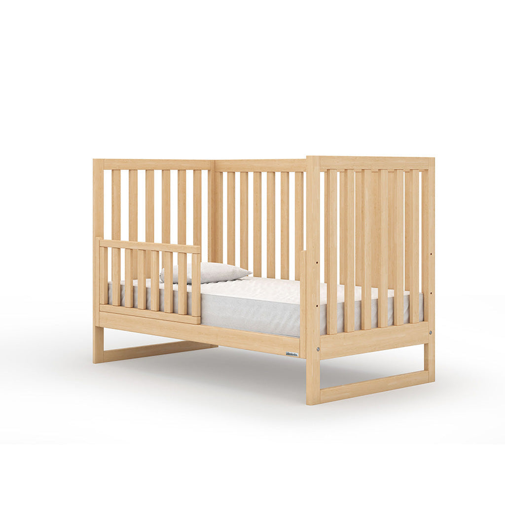  Three mattress positions assist in converting this crib for multiple growth stages. Complete with baby-safe finishes and meets strict JPMA standards. Shown converted with Toddler Bed Rail, sold separately. 