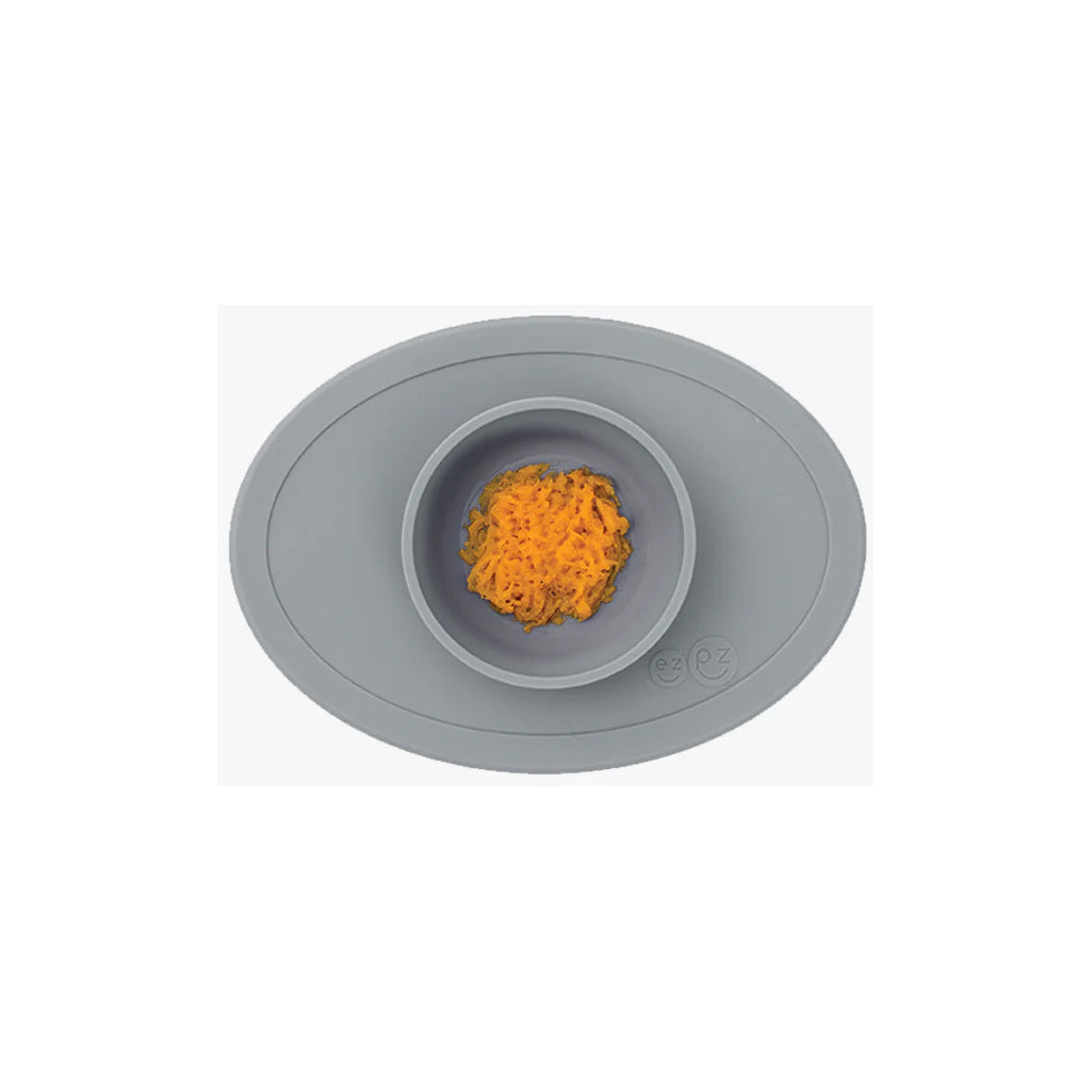 The Dark Grey ezpz baby solid food bowl makes mealtime easier with a strong suction base.