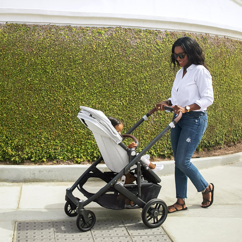Woman Walking Baby in Uppababy CRUZ V2 Stroller