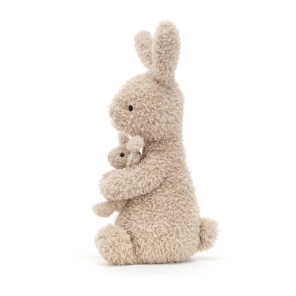 Jellycat Huddles Bunny Children's Plush Stuffed Animal Toy - Bunny gripping tightly onto the baby bunny while sitting and facing the left