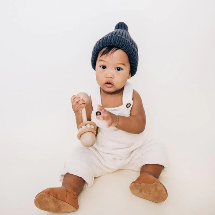 Huggalugs Indigo Peak Knit Beanie Infant to Child Winter Hat modeled on infant.