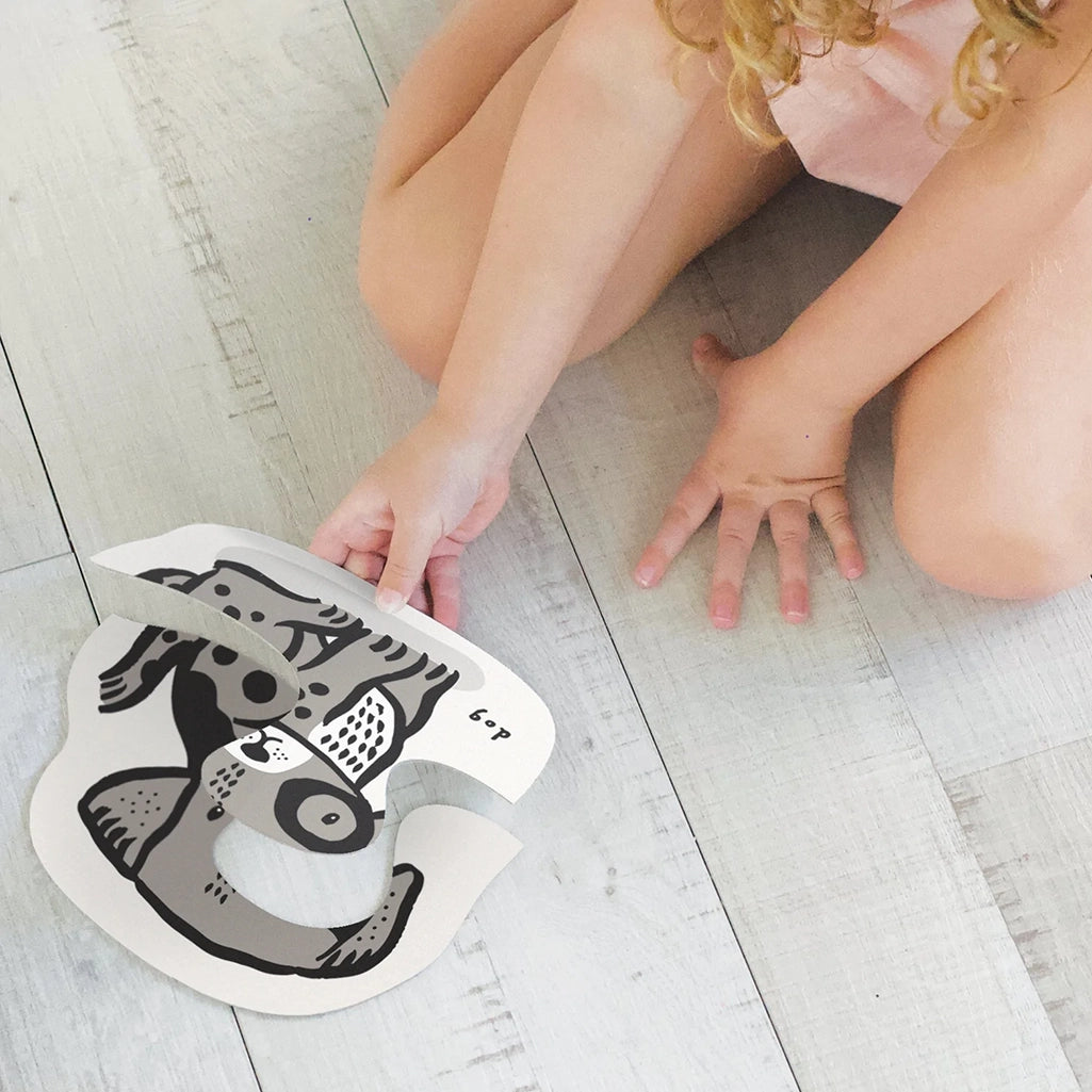 Wee Gallery Pets Beginner Puzzles Children's Learning Puzzle Set. Lifestyle photo of child playing with puzzle sets.