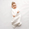 Baby Wearing Kyte Baby Sleep Sack in Cloud White