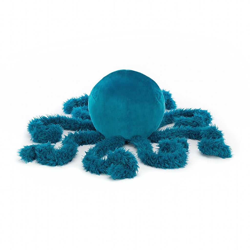 Jellycat Letty Jellyfish Children's Stuffed Ocean Animal Plush Toys - deep bright blue, small smile, half closed eyes, very round bulbous head, curly fuzzy tentacles, facing away from the camera