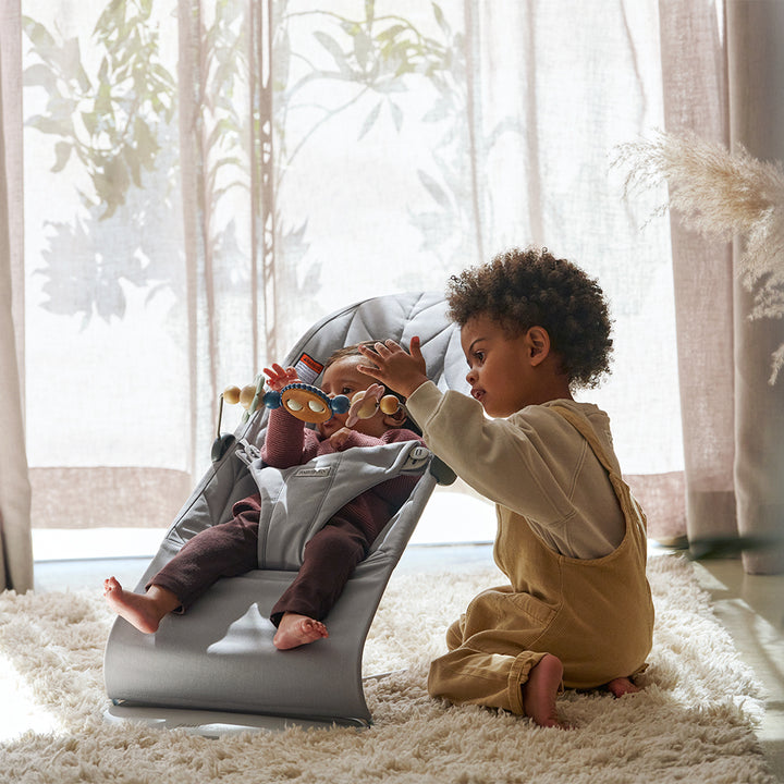 Baby Bjorn bouncer in grey with baby bouncer with toys