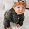 Huggalugs Loden Garter Stitch Cardigan Sweater modeled on infant.