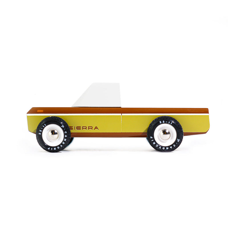 Stylish wooden car toy by Candylab, perfect for kids and collectors.