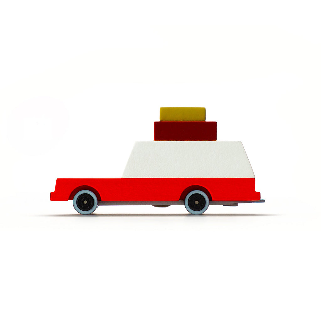 Red luggage wagon by Candylab, a charming natural wooden toy vehicle.