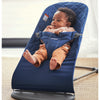 infant looking to side in babybjorn bouncer bliss blue