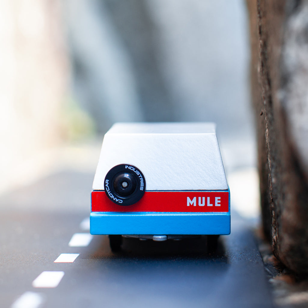 The back of the Candylab Toys Blue Mississippi Mule wooden car, showcasing its sleek design.