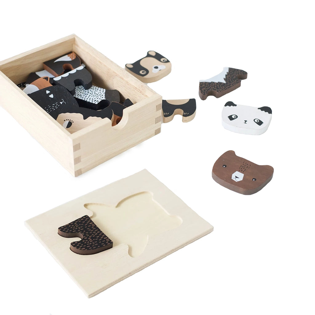 Wee Gallery Mix & Match Animal Tiles Wooden Dress Up Play Set. Flatlay of a few pieces out on the wooden box lid with remaining pieces in storage box.