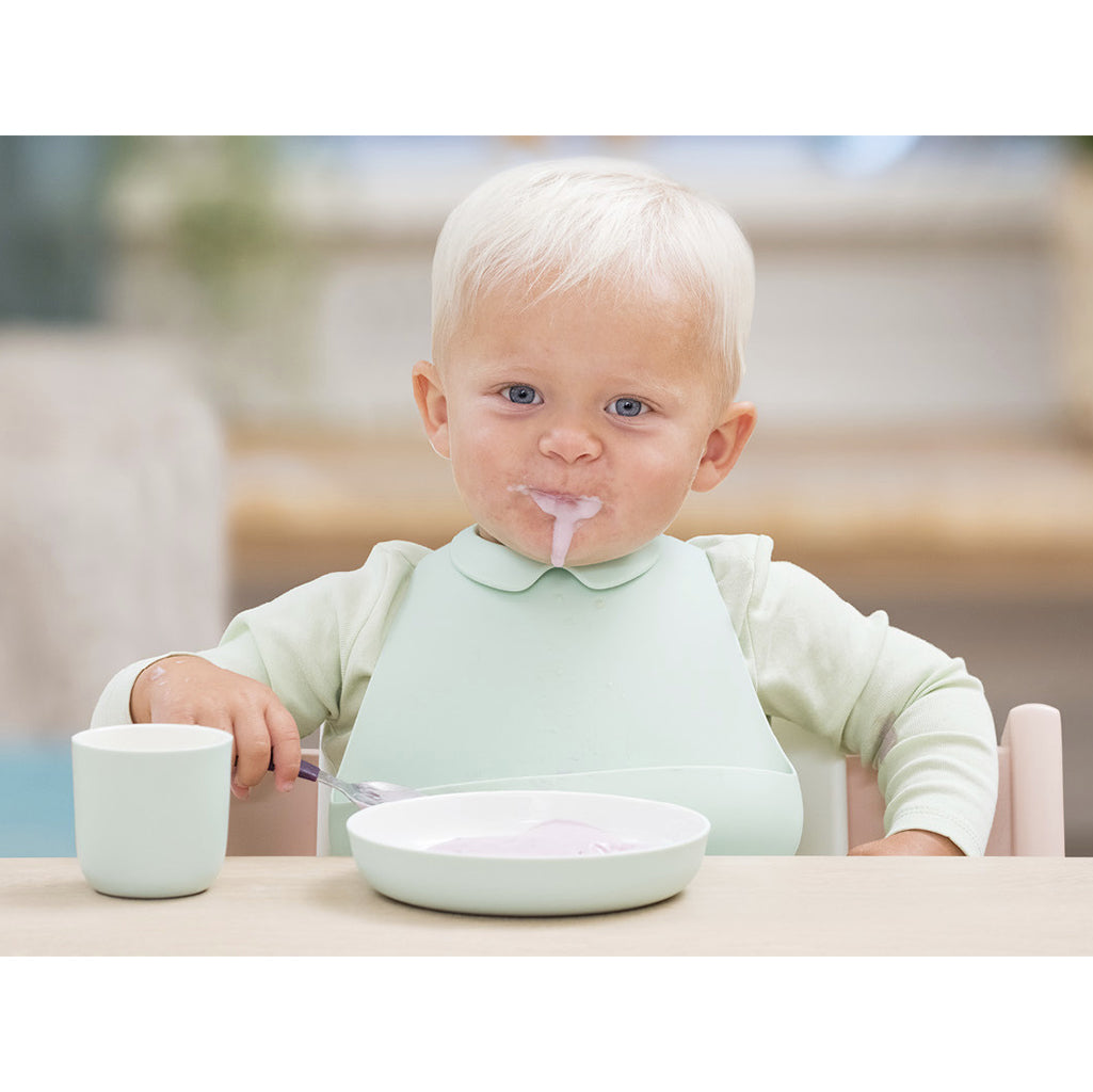 Stokke Munch Bib - Soft Mint, made from soft and durable materials for ultimate comfort