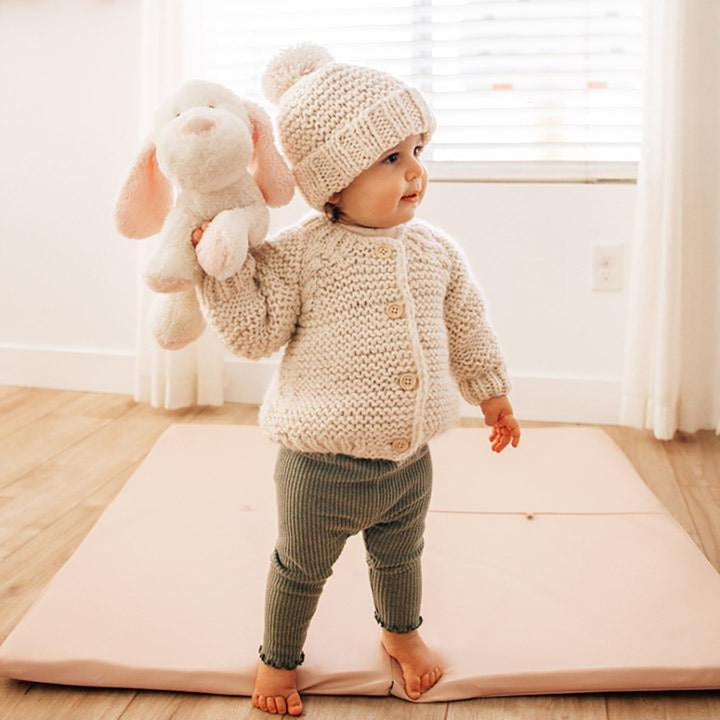 Huggalugs Natural Garter Stitch Cardigan Sweater modeled on infant.