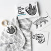 Wee Gallery Rainforest Little Naturalist Gift Set Baby Activity Set. Contents spread out for easier view. Features teether, blanket, and two of the art cards.
