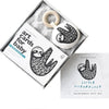 Wee Gallery Rainforest Little Naturalist Gift Set Baby Activity Set. Black and white with natural wooden teether ring. Features a sloth on the crinkle teether. Various rainforest animals on the art cards.