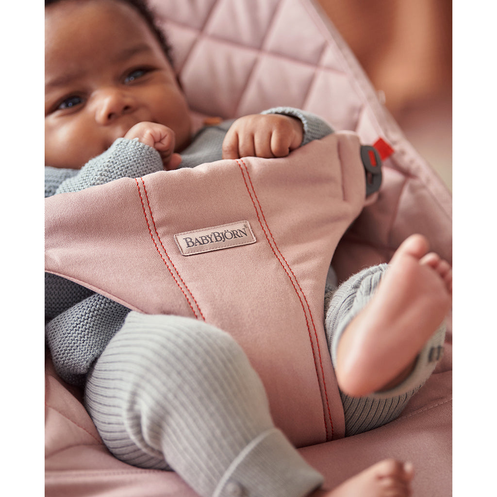 baby with legs out in old rose babybjorn bliss bouncer
