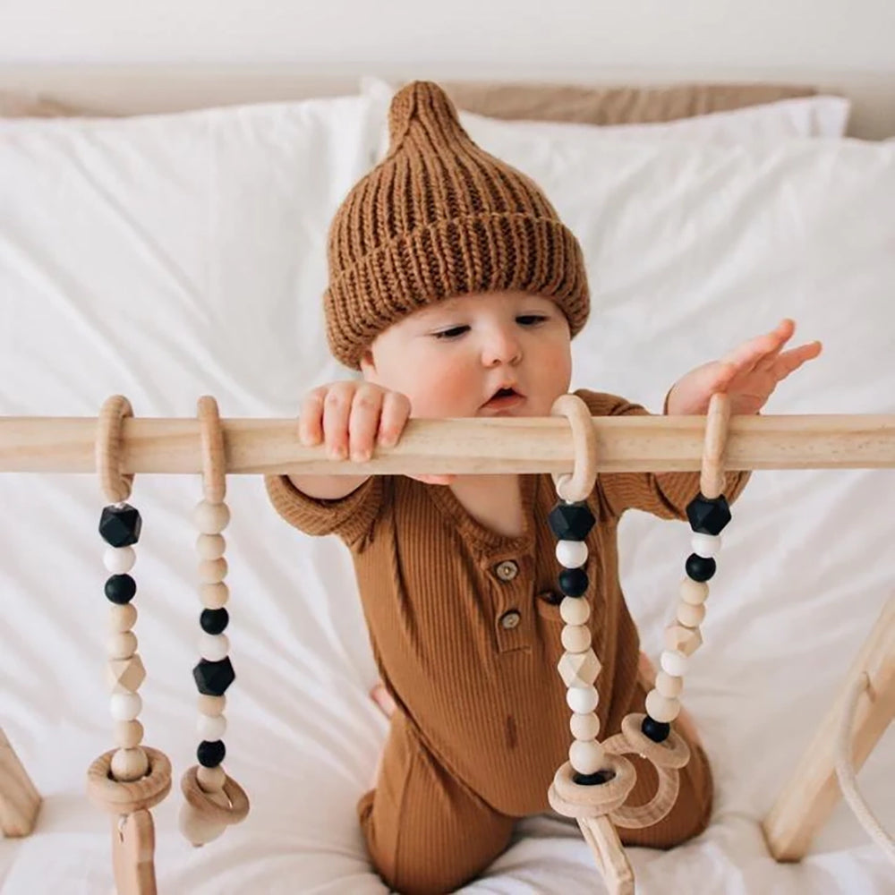 Huggalugs Pecan Peak Knit Beanie modeled on infant.