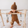 Huggalugs Pecan Peak Knit Beanie modeled on infant.
