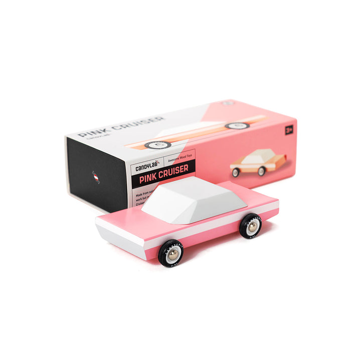Pink Cruiser wooden car by Candylab, paired with its stylish packaging.