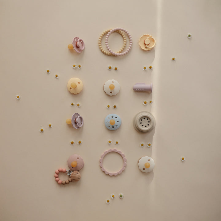 Mushie baby teething toys featuring soft silicone for safe chewing and relief